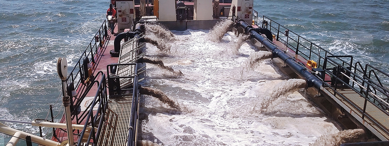 Army Corps of Engineering dredging ship actively dredging