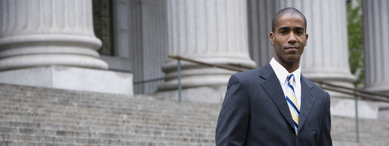 Businessman standing on steps of federal buidling