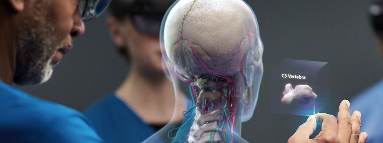 Surgeon and medical team, using HoloLens 2 to assist in an operating theatre
